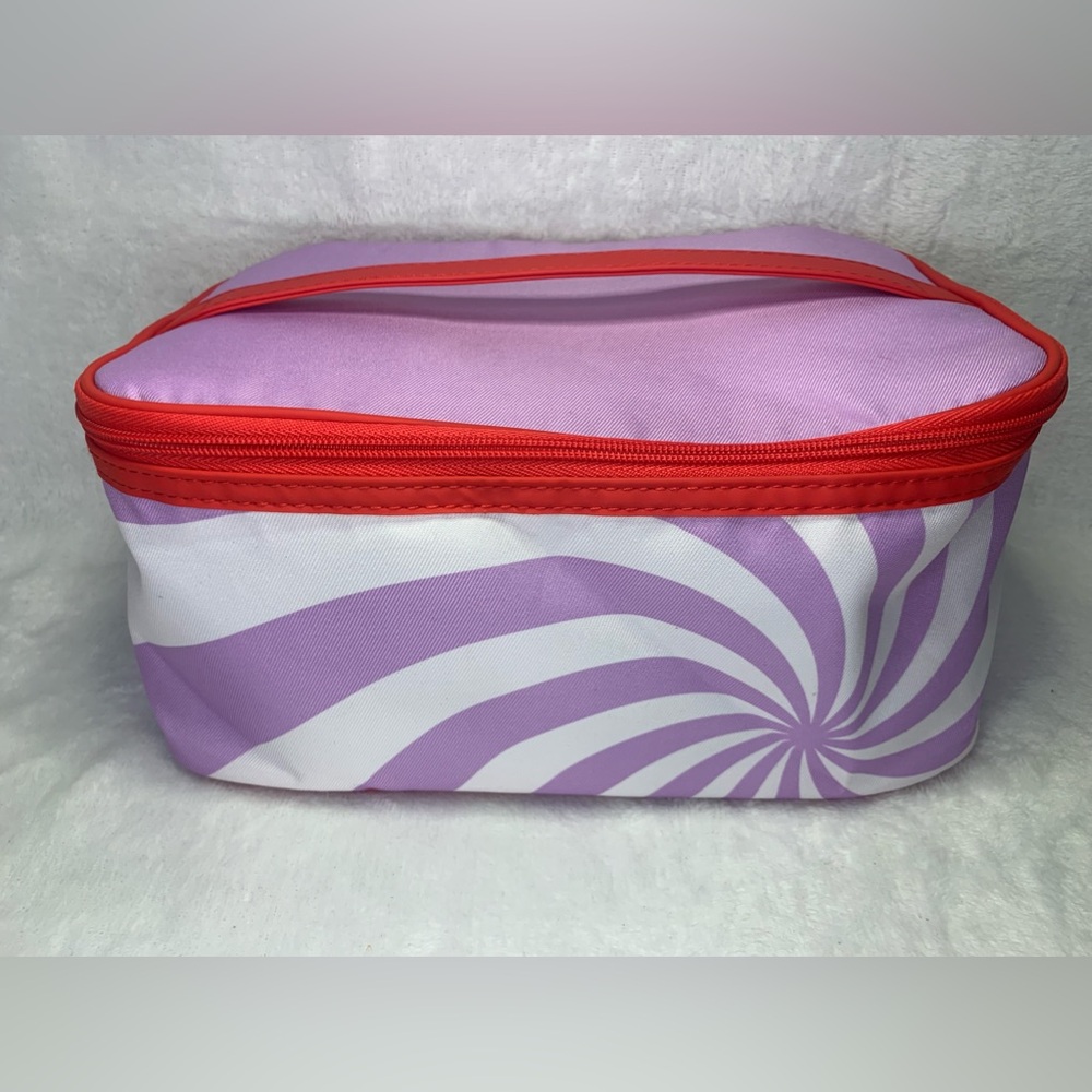 Spiral print cosmetic bag with zipper closure